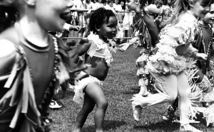 Getting carried away by the dancing at the Garston Carnival is two year old Felicia Zenko Getting carried away by the dancing at the Garston Carnival is two year old Felicia Zenko