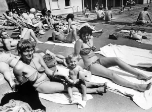 Getting a tan beside Clifton swimming pool are Heidi Hopkins with her 18-month old son Getting a tan beside Clifton swimming pool are Heidi Hopkins with her 18-month old son