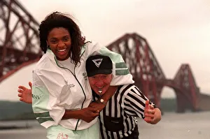 Gladiator Rocket ( Pauline Richards) gets a head lock on referee John Anderson with Gladiator Rocket ( Pauline Richards) gets a head lock on referee John Anderson with