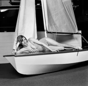 Top glamour model Stephanie McLean posing lying down in a sailboat January 1975 Top glamour model Stephanie McLean posing lying down in a sailboat January 1975