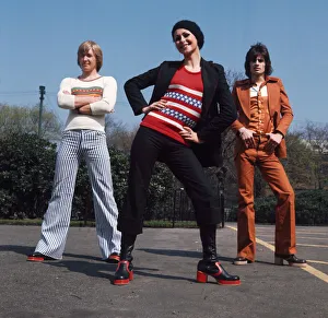 Glasgow fashion 1972 Two men and one woman wearing flared trousers, platform shoes Glasgow fashion 1972 Two men and one woman wearing flared trousers, platform shoes