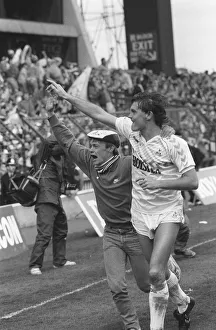 Glenn Hoddle running with a fan on the pitch after the match Glenn Hoddle running with a fan on the pitch after the match