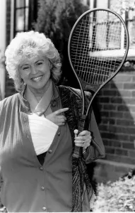 Gloria Hunniford TV Presenter holding the tennis racket she was useing when she broke her Gloria Hunniford TV Presenter holding the tennis racket she was useing when she broke her