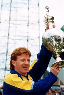 Gordon Strachan of Leeds United holds up the First division league championship trophy Gordon Strachan of Leeds United holds up the First division league championship trophy