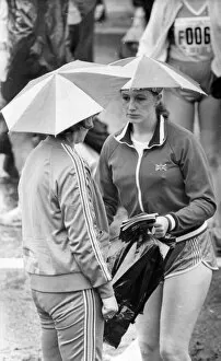 Images Dated 27th June 1982: The Great North Run 27 June 1982 - Two runners keep dry before the race