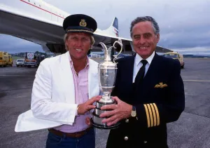 Greg Norman holds the Claret Jug trophy after winning the British Open with Concorde Greg Norman holds the Claret Jug trophy after winning the British Open with Concorde