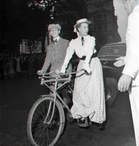 Guests arrive in Edwardian dress on a bicycle made for two for the premiere of " Guests arrive in Edwardian dress on a bicycle made for two for the premiere of "