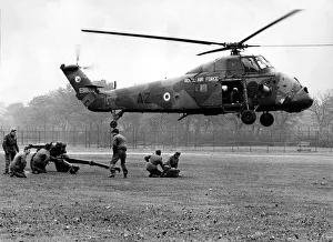 A gun crew of the 14th Light Regiment, Royal Artillery, stand at the ready as a Royal Air A gun crew of the 14th Light Regiment, Royal Artillery, stand at the ready as a Royal Air