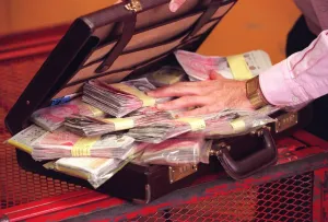 Harry Harris with a briefcase full of money Harry Harris with a briefcase full of money