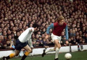 Harry Redknapp of West Ham United in a chase for the ball with John Robson of Derby Harry Redknapp of West Ham United in a chase for the ball with John Robson of Derby