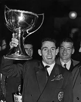 Hearts captain Dave Mackay proudly holds aloft the league cup. 25th October 1958 Hearts captain Dave Mackay proudly holds aloft the league cup. 25th October 1958