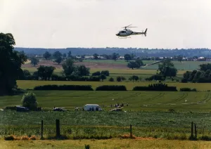 A helicoper hovers over a field at Studley Grange, Warwickshire during the making of TV A helicoper hovers over a field at Studley Grange, Warwickshire during the making of TV