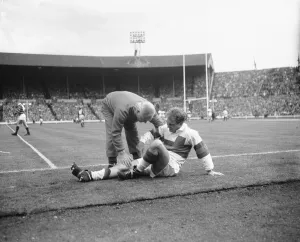 Hirst of Wakefield Trinity seen here gets treatment for a injury leg during the Rugby Hirst of Wakefield Trinity seen here gets treatment for a injury leg during the Rugby