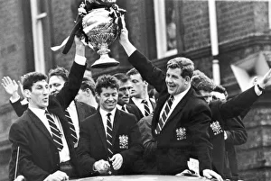 Holding the cup aloft are Captain Vince Karalius (left) Holding the cup aloft are Captain Vince Karalius (left)