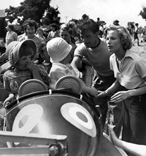 Honor Blackman and Richard Burton in a fairground Honor Blackman and Richard Burton in a fairground