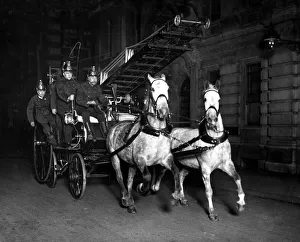 Horse-Drawn Fire Engine with escape ladder. April 1914 Horse-Drawn Fire Engine with escape ladder. April 1914