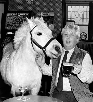 Horse trainer Trevor Simmons with Dimples the horse at the local pub. March 1985 Horse trainer Trevor Simmons with Dimples the horse at the local pub. March 1985