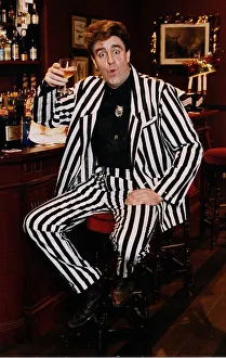 Iain McColl actor white black striped suit bar drink whisky Iain McColl actor white black striped suit bar drink whisky