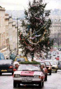Ian Johnson drives his Ford Capri with a Christmas tree on the roof of the car Ian Johnson drives his Ford Capri with a Christmas tree on the roof of the car