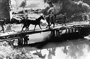 US infantry of Mars Task Force cross temporary bridge in Burma during WW2 US infantry of Mars Task Force cross temporary bridge in Burma during WW2