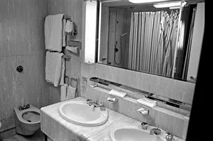 Interior view showing one of the cabin bathrooms aboard the luxury passenger liner QE2 Interior view showing one of the cabin bathrooms aboard the luxury passenger liner QE2