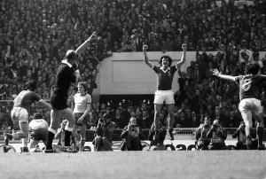 Ipswich players Derek Nippard and Roger Osborne celebrate at the final whistle as they Ipswich players Derek Nippard and Roger Osborne celebrate at the final whistle as they