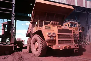 Iron ore truck unloading ore at the primary crusher at Sishen iron ore mine Iron ore truck unloading ore at the primary crusher at Sishen iron ore mine