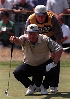 Jack Nicklaus Golfer measures up the line of play with his son Steve on the 18th green Jack Nicklaus Golfer measures up the line of play with his son Steve on the 18th green