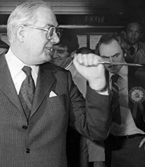 James Callaghan holding knife up before cutting cake - April 1979 24/04/1979 James Callaghan holding knife up before cutting cake - April 1979 24/04/1979