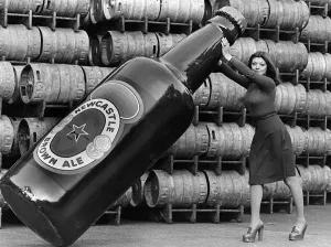 Janette Harper with a Giant Newcastle Brown Ale Bottle 1977 Janette Harper with a Giant Newcastle Brown Ale Bottle 1977