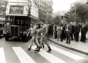 Japanese model carried over Zebra crossing Yashiko Mori 23 by two sumo wrestlers across Japanese model carried over Zebra crossing Yashiko Mori 23 by two sumo wrestlers across