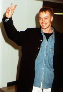 Jason Donovan giving two finger peace sign Jason Donovan giving two finger peace sign