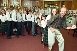 Images Dated 8th July 1991: Jasper Carrott receives the £2000 cheque for Comic Relief from pupils at Sir