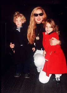 Jerry Hall model with children Elizabeth Scarlet and James at Heathrow airport leaving Jerry Hall model with children Elizabeth Scarlet and James at Heathrow airport leaving
