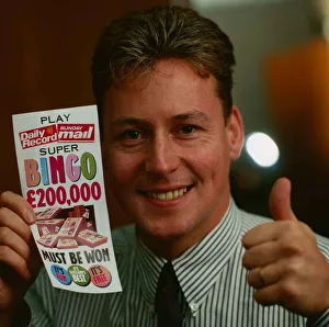 Jim White holding Daily Record and Sunday Mail bingo card September 1989 Jim White holding Daily Record and Sunday Mail bingo card September 1989