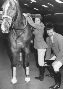 Jimmy Hill helps Angela Rippon to get onto her horse. 18th March 1978 Jimmy Hill helps Angela Rippon to get onto her horse. 18th March 1978