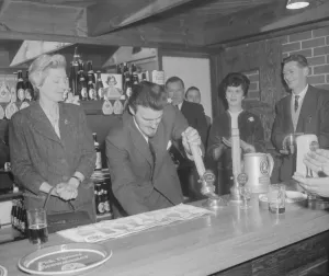 Jimmy Hill tries his hand at pulling a pint of beer at the official opening of The Rose Jimmy Hill tries his hand at pulling a pint of beer at the official opening of The Rose