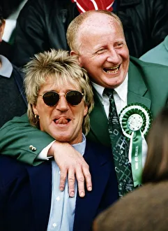 Jimmy Johnstone footballer with arm around singer Rod Stewart smiling tongue Jimmy Johnstone footballer with arm around singer Rod Stewart smiling tongue