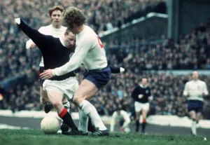 Jimmy Johnstone of Scotland battles for control of the ball with Alan Ball of England Jimmy Johnstone of Scotland battles for control of the ball with Alan Ball of England