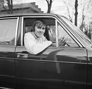 00236 Collection: Jimmy Rimmer of Manchester United sitting in his car