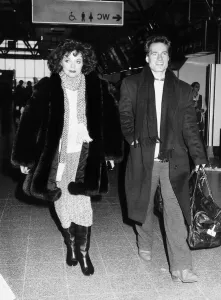 Joan Collins the actress with actor Neil Dickinson on their way to Los Angeles in Joan Collins the actress with actor Neil Dickinson on their way to Los Angeles in