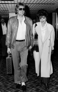 Joan Collins British actress arrives at Heathrow with husband Peter in April 1986 Joan Collins British actress arrives at Heathrow with husband Peter in April 1986