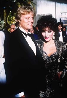 Images Dated 28th April 1989: Joan Collins with her new man Malcolm Frazer at a film Premiere at the Odeon Leicester