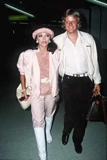 Joan Collins and Peter Holm at London Airport on the way to Nice September Joan Collins and Peter Holm at London Airport on the way to Nice September