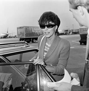 Images Dated 8th September 1983: Joan Collins with her son Sacha, 17, arriving at Heathrow from Los Angeles