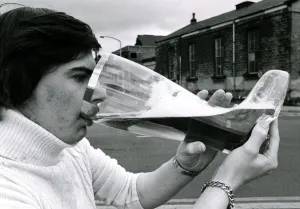 Joe Bailey drinking from a giant glass boot that he bought in Germany that holds 4 1/2 Joe Bailey drinking from a giant glass boot that he bought in Germany that holds 4 1/2
