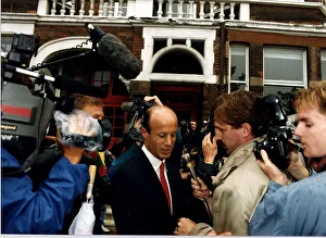 John Bryan surrounded by TV and Press reporters and cameramen John Bryan surrounded by TV and Press reporters and cameramen