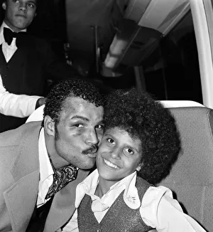 John Conteh celebrates with family aboard a playboy motor coach after winning world title John Conteh celebrates with family aboard a playboy motor coach after winning world title