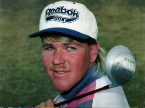 John Daly on golf course with killer whale golf club over his shoulder Muirfield outdoors John Daly on golf course with killer whale golf club over his shoulder Muirfield outdoors