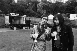 John Entwistle and Keith Moon of the rock group The Who show off their new cars at John Entwistle and Keith Moon of the rock group The Who show off their new cars at